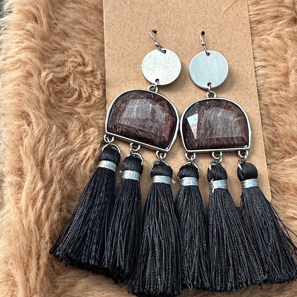 Tassel Trot" black earrings.
